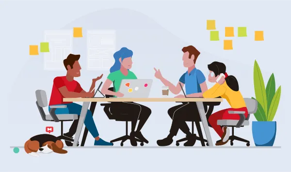 Four%20people%20sitting%20at%20a%20desk%20working